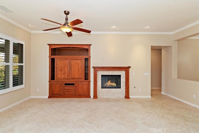 unfurnished living room featuring crown molding, visible vents, baseboards, and ceiling fan