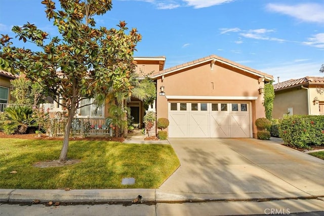 view of front of home with a front yard and a garage