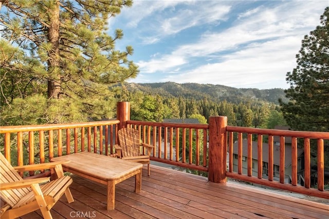 wooden deck featuring a mountain view