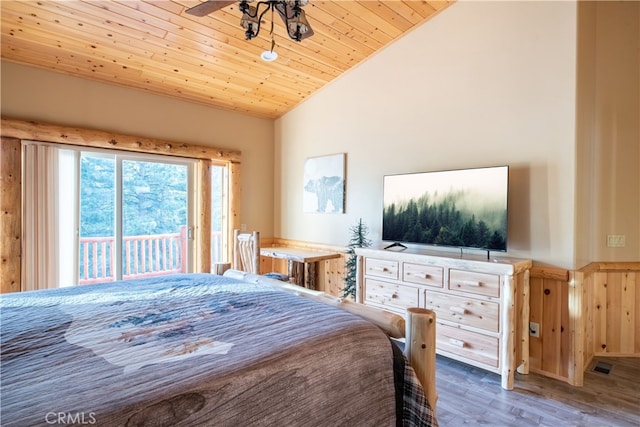 bedroom with access to outside, dark hardwood / wood-style flooring, lofted ceiling, and wood ceiling