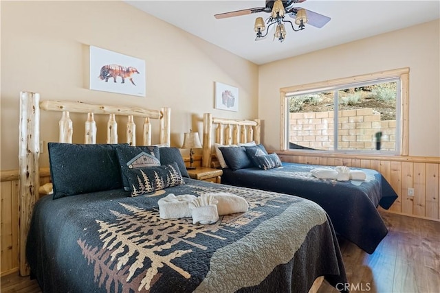 bedroom featuring hardwood / wood-style flooring and ceiling fan