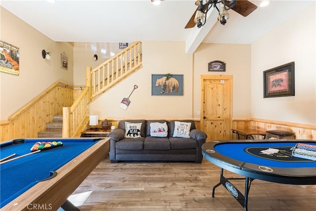 game room featuring ceiling fan, hardwood / wood-style floors, billiards, and wooden walls