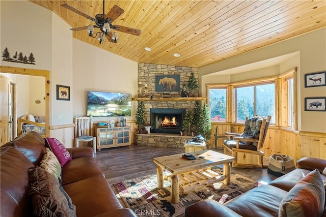 living room featuring wood ceiling, ceiling fan, dark hardwood / wood-style floors, a fireplace, and high vaulted ceiling