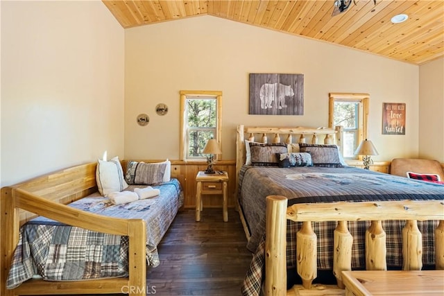 bedroom featuring lofted ceiling, dark wood-type flooring, multiple windows, and wooden ceiling