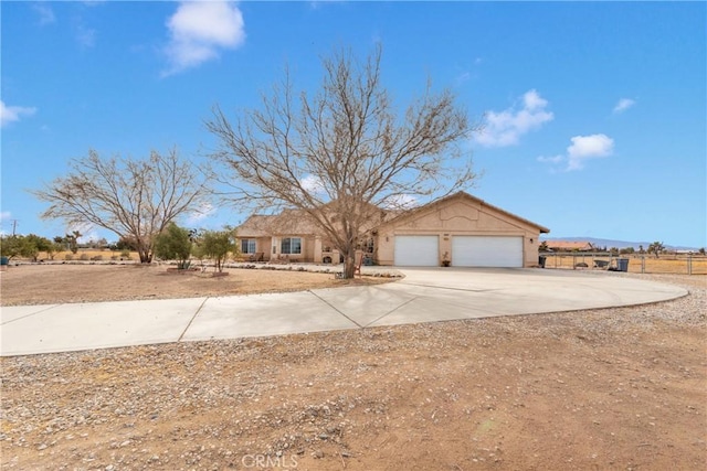 ranch-style home with a garage