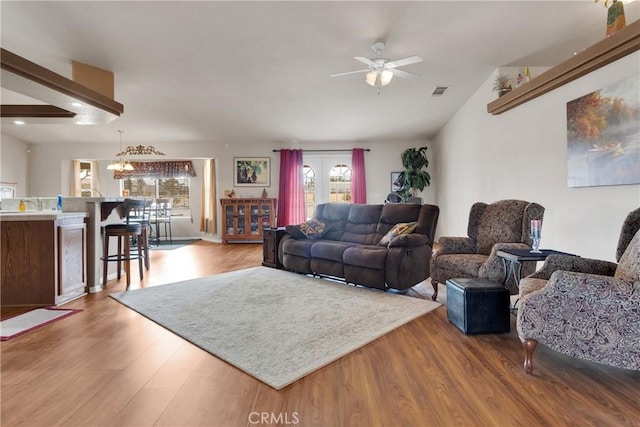 living room featuring ceiling fan, a healthy amount of sunlight, and hardwood / wood-style flooring