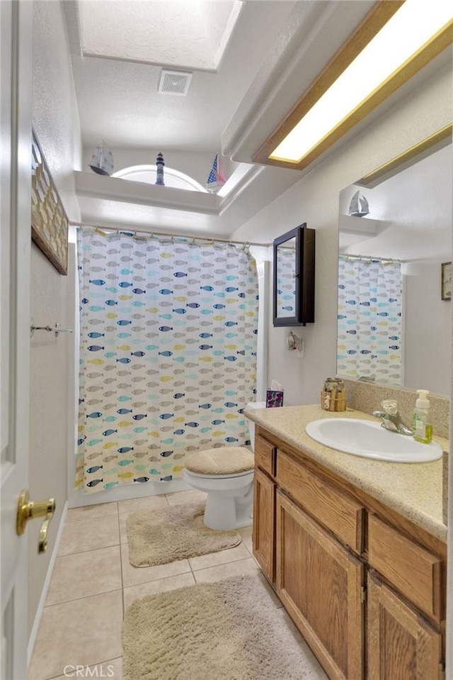 bathroom with toilet, tile patterned flooring, a shower with curtain, and vanity