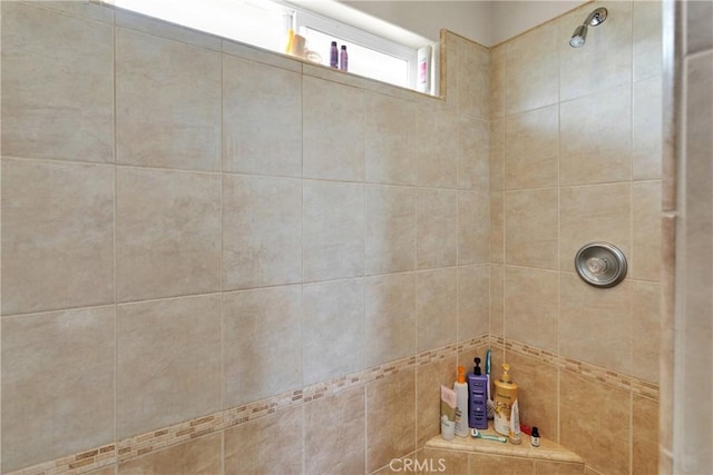 bathroom featuring tiled shower