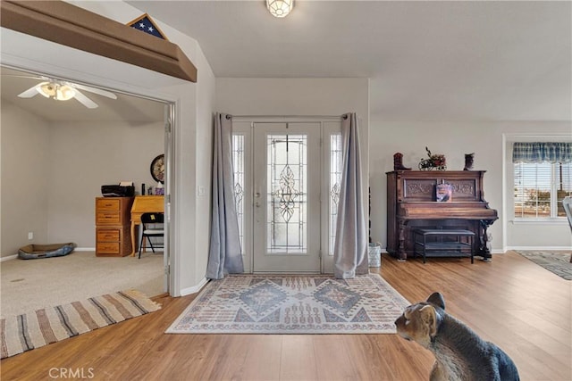 entryway with ceiling fan and hardwood / wood-style floors