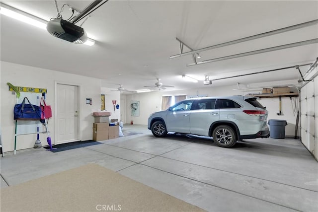 garage with ceiling fan and a garage door opener