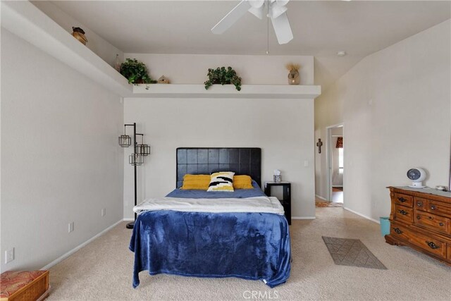 bedroom with ceiling fan and light carpet