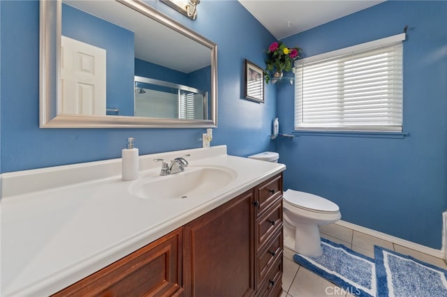 bathroom featuring toilet, tile patterned floors, and vanity