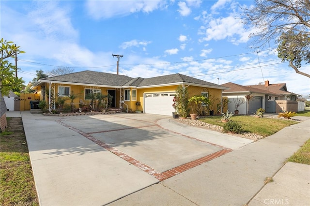 ranch-style house featuring a garage and a front lawn