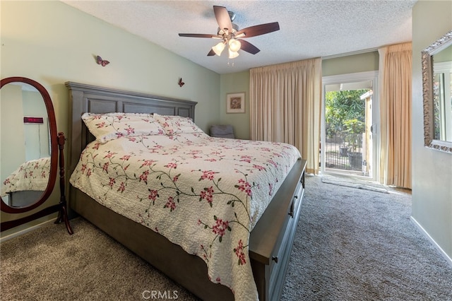 carpeted bedroom with ceiling fan and a textured ceiling