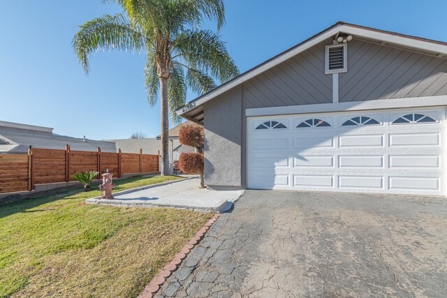 garage with a yard