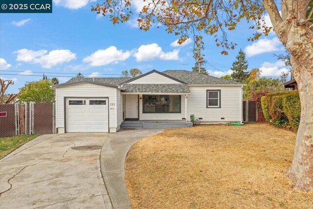 ranch-style house featuring a front lawn and a garage