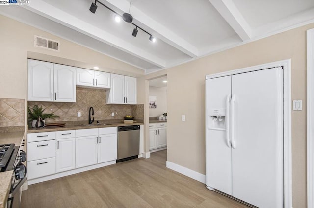 kitchen featuring stainless steel appliances, light wood-type flooring, decorative backsplash, sink, and white cabinetry