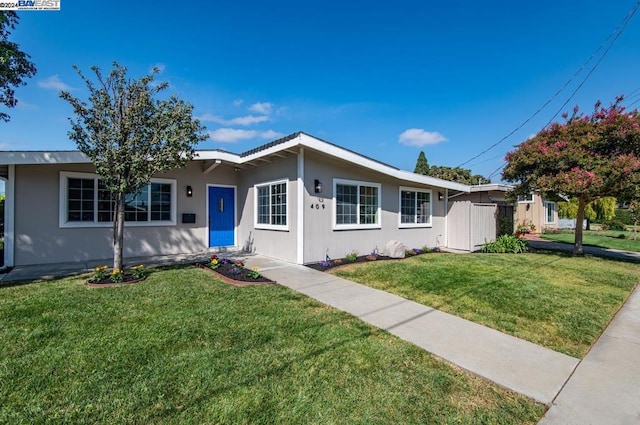 ranch-style home with a front lawn