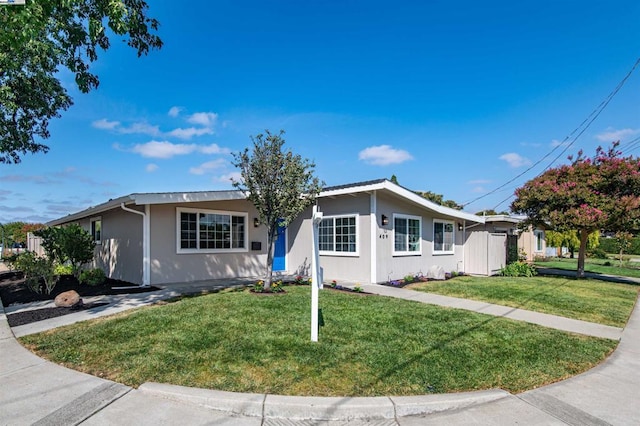 single story home with a front yard