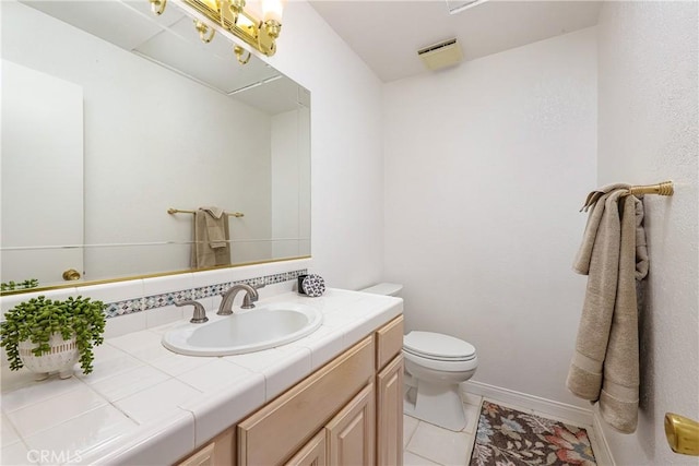 bathroom with decorative backsplash, tile patterned floors, vanity, and toilet