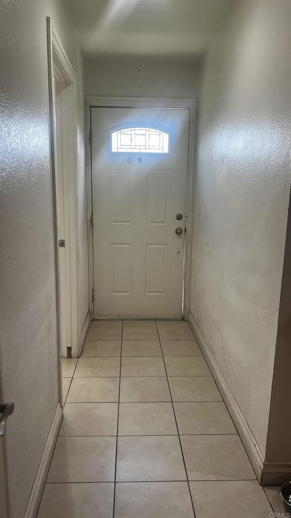 851 S Mollison Ave Unit 29, El Cajon, CA 92020 - entryway with light tile patterned flooring and baseboards