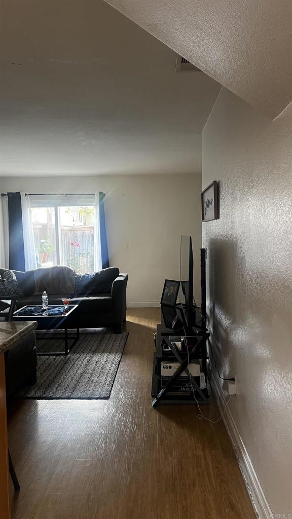 851 S Mollison Ave Unit 29, El Cajon, CA 92020 - living area with wood finished floors and baseboards