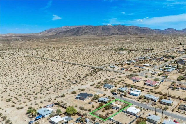 drone / aerial view featuring a mountain view