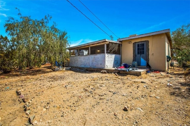 rear view of house with a sunroom