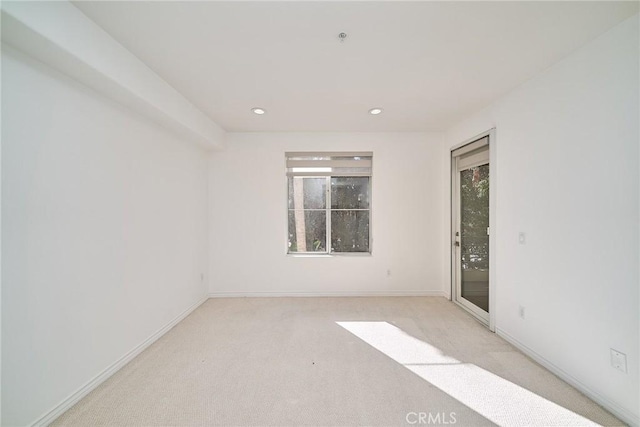 empty room with light colored carpet