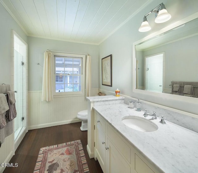 bathroom with toilet, wood ceiling, hardwood / wood-style flooring, crown molding, and vanity