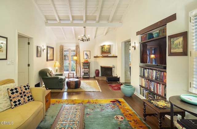 living room featuring wooden ceiling, vaulted ceiling with beams, hardwood / wood-style floors, and a notable chandelier