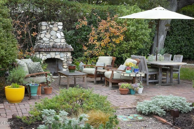 view of patio featuring an outdoor living space with a fireplace