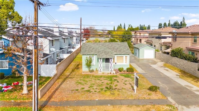 view of front of property with an outbuilding and a garage