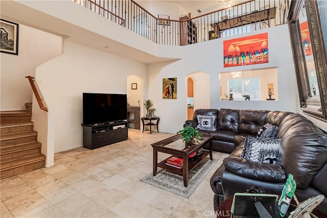 living room featuring a high ceiling