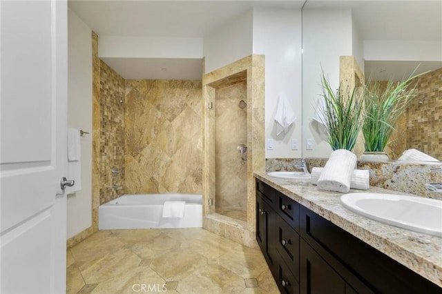 bathroom featuring vanity and shower with separate bathtub