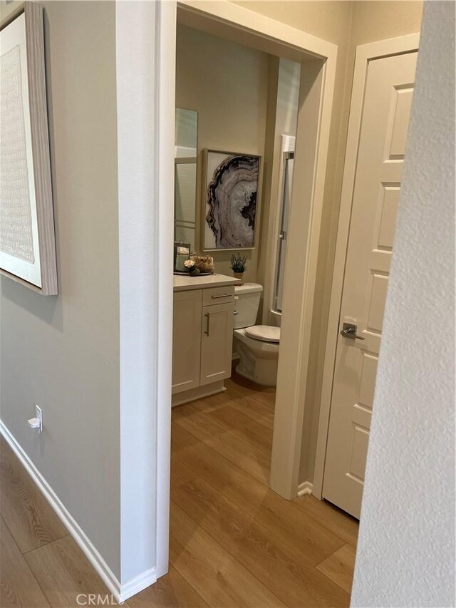 hallway with light wood-type flooring