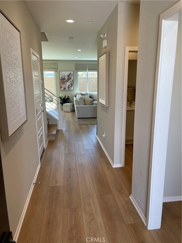 hall with light wood-type flooring