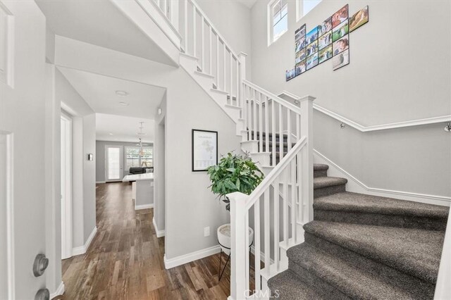 stairs with wood-type flooring