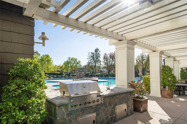 view of patio featuring a pergola, sink, and area for grilling