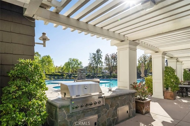 view of patio featuring a pergola, sink, a grill, and area for grilling