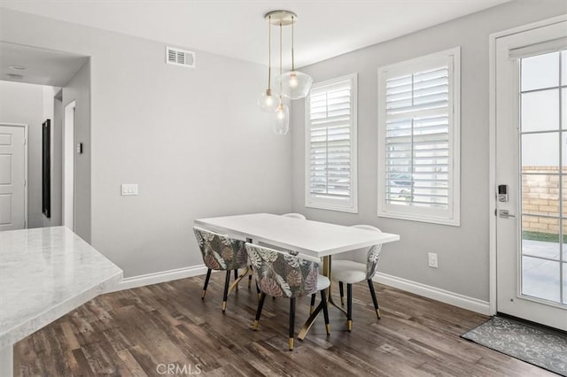 dining room with dark wood-type flooring