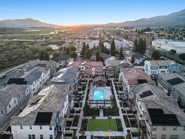 birds eye view of property featuring a mountain view