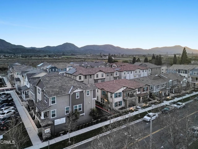 birds eye view of property with a mountain view