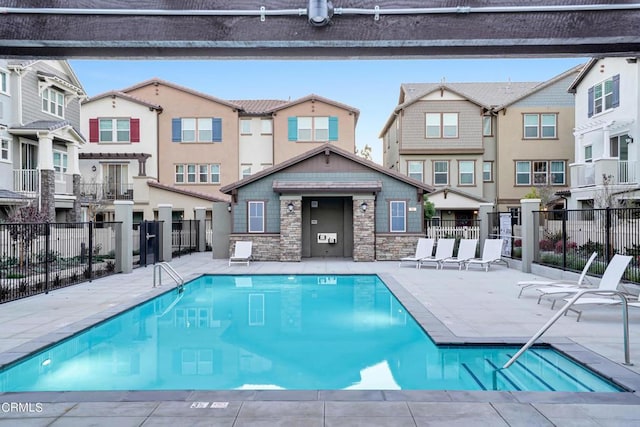 view of swimming pool with a patio area