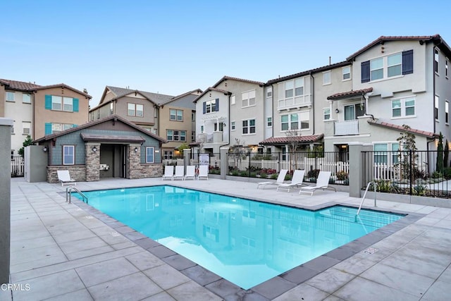 view of swimming pool featuring a patio area