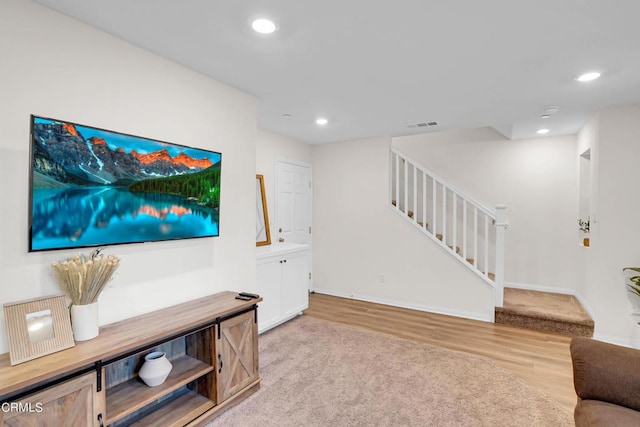 living room with light hardwood / wood-style floors