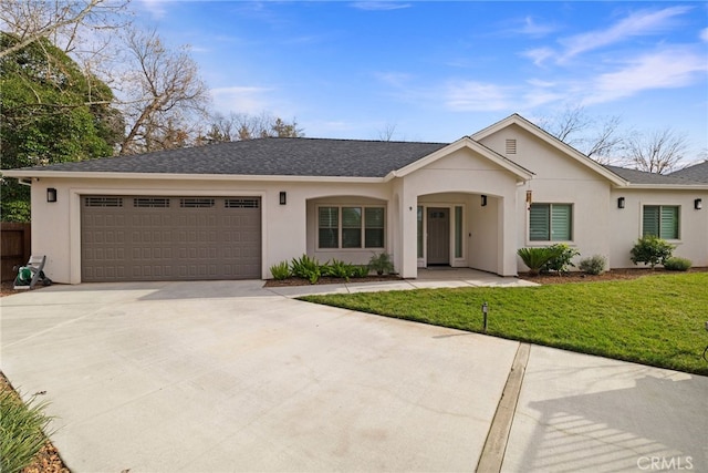 ranch-style home featuring a front lawn and a garage