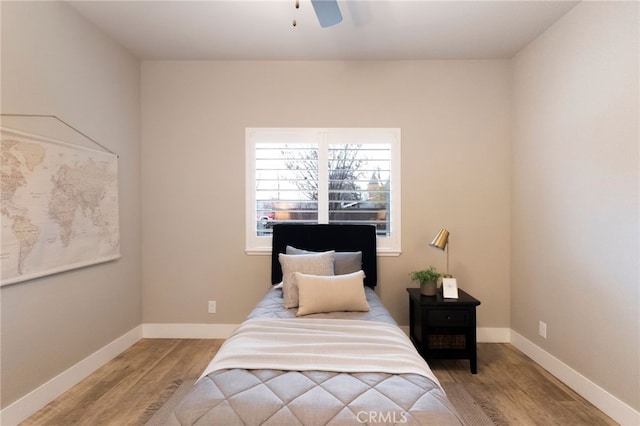 bedroom with ceiling fan and light hardwood / wood-style floors