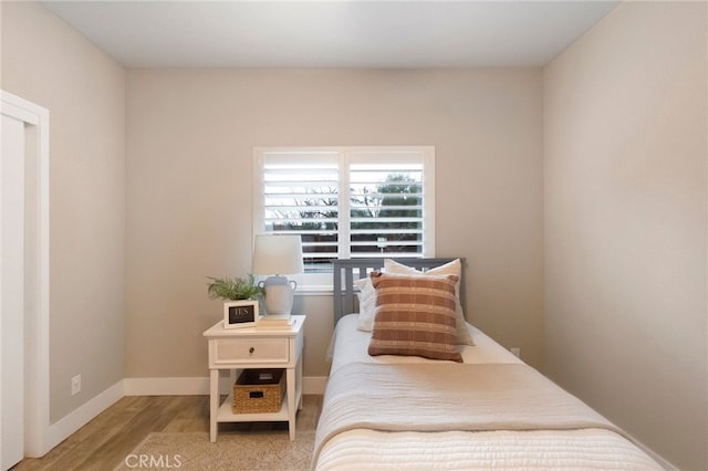 bedroom featuring hardwood / wood-style flooring