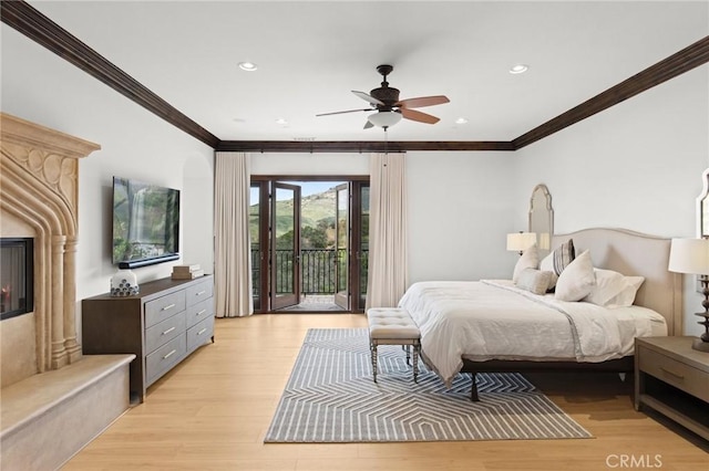 bedroom with ceiling fan, light hardwood / wood-style flooring, access to outside, and ornamental molding